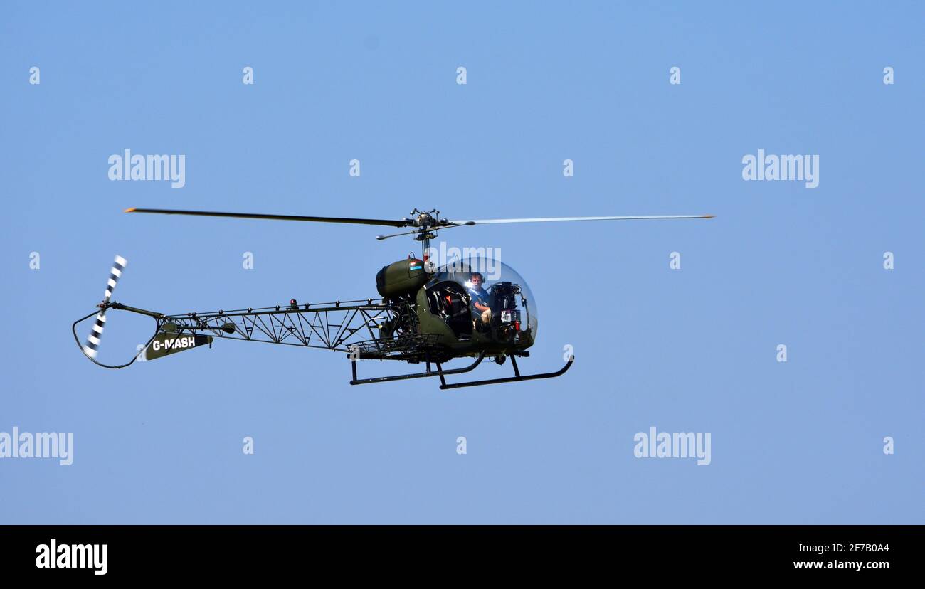 Bell 47G-4A G - MASH  Helicopter in flight Stock Photo