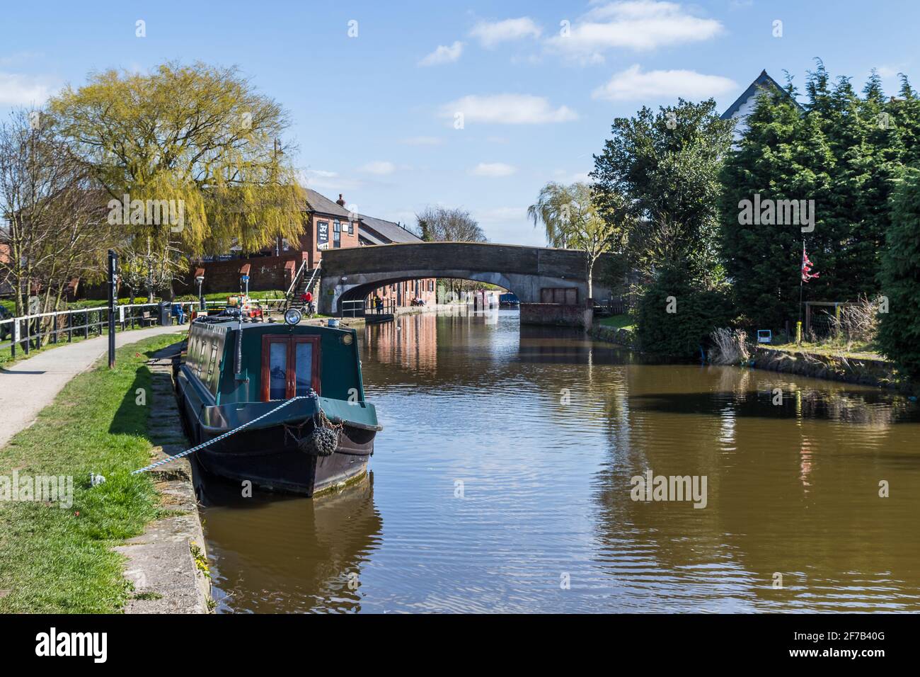 The Leeds Liverpool Canal passes throug Burscough, Lancashire in April 2021 seen from the tow path. Stock Photo