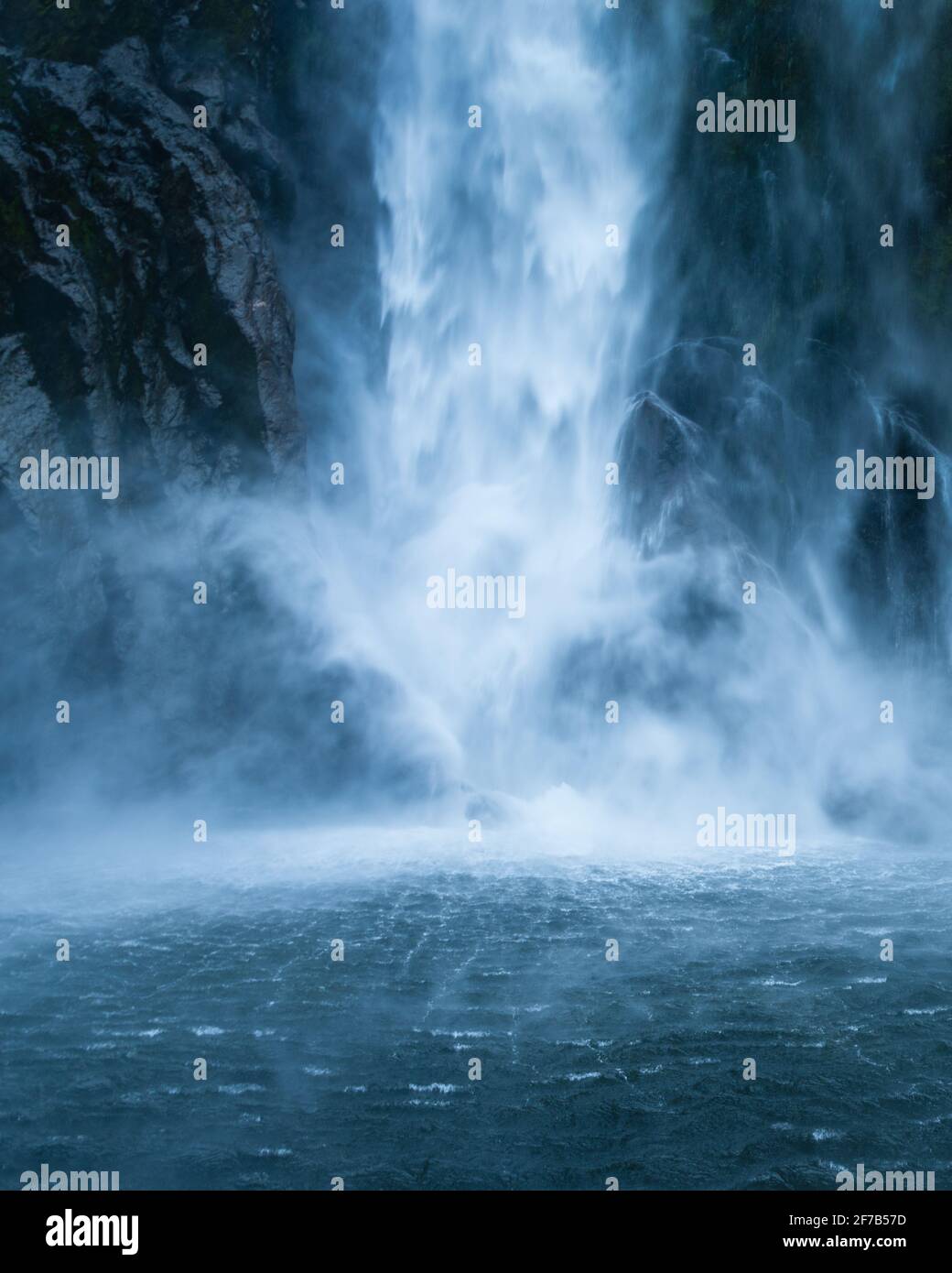 Base of Stirling Falls in Milford Sound, New Zealand. Vertical format. Stock Photo