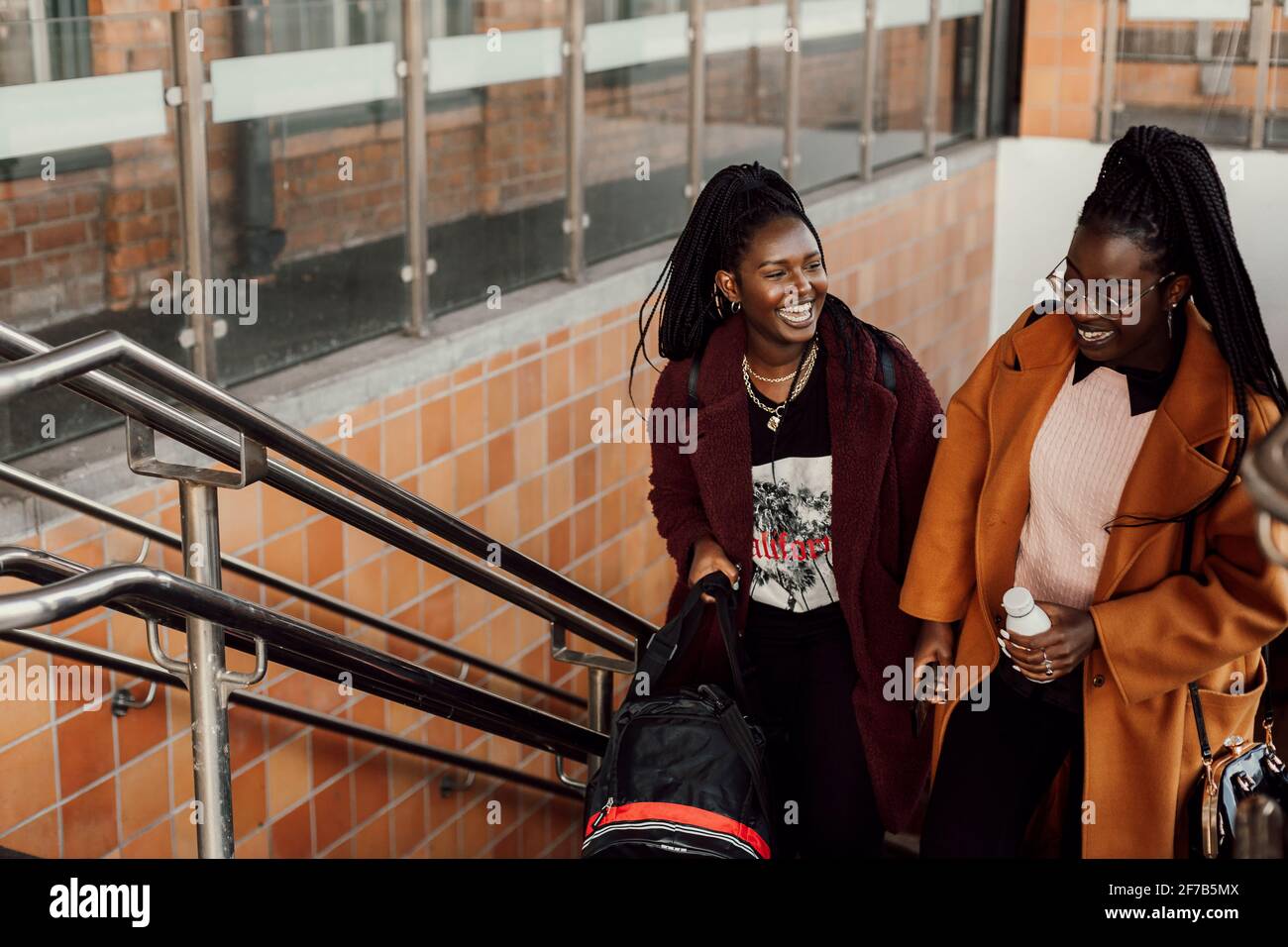 Two people walking up stairs hi-res stock photography and images - Alamy
