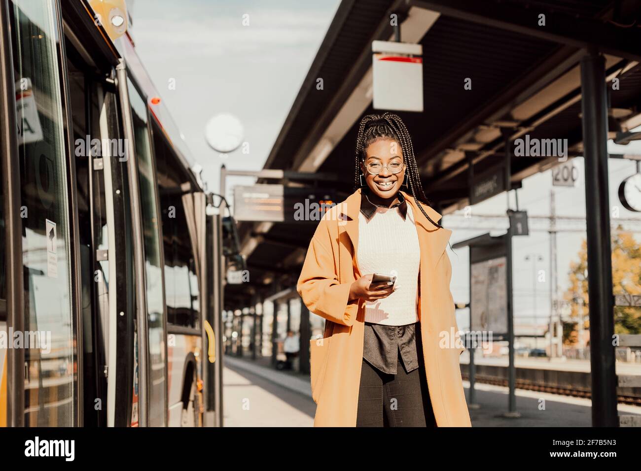 Woman waiting bus hi-res stock photography and images - Alamy