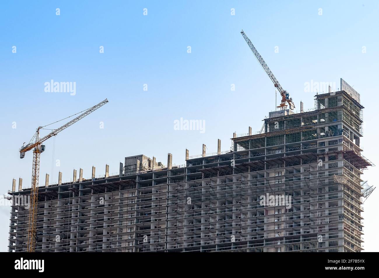 Mega construction site of real estate with tower cranes. New skyscraper