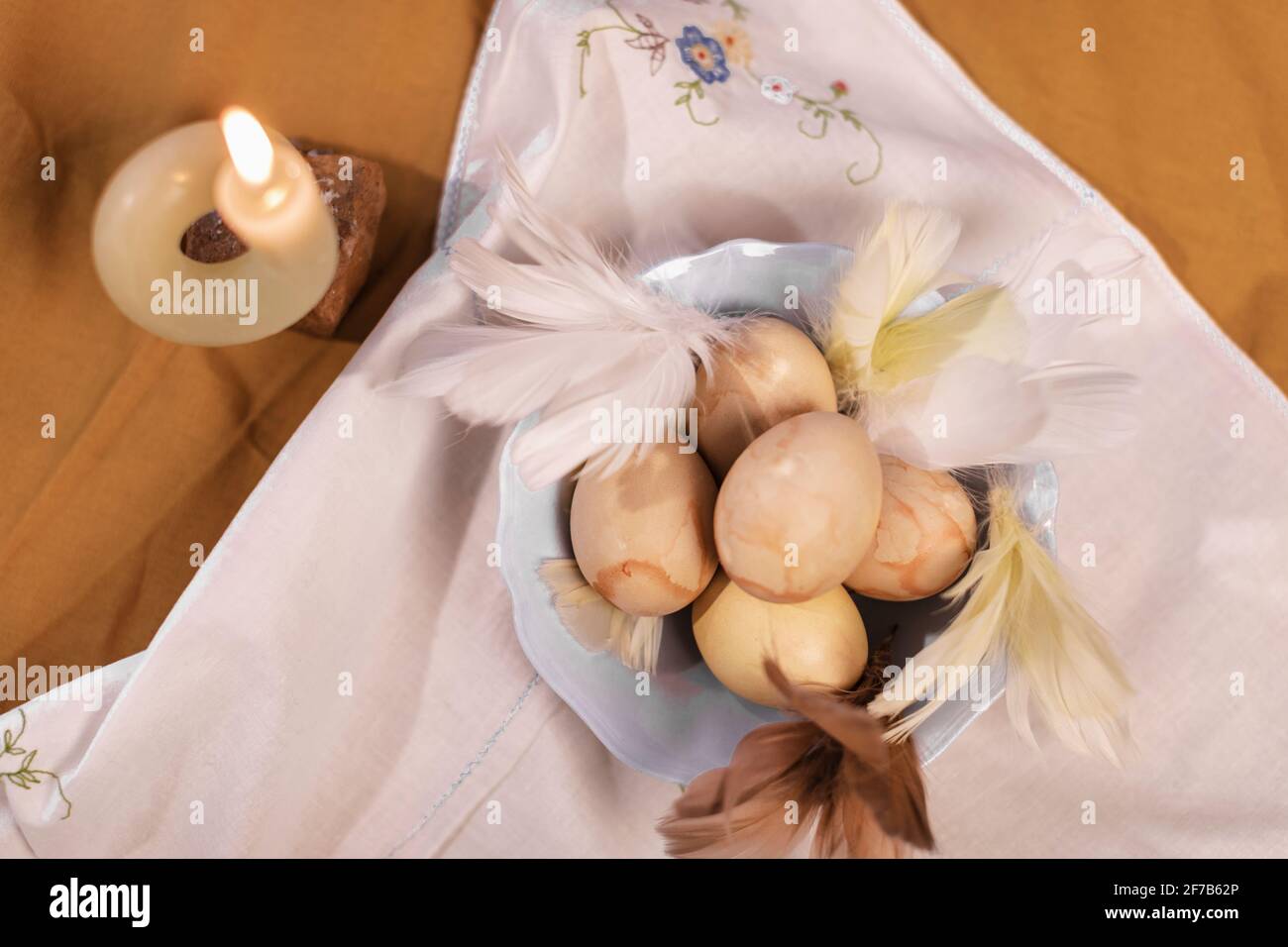 Easter eggs in bowl on table Stock Photo