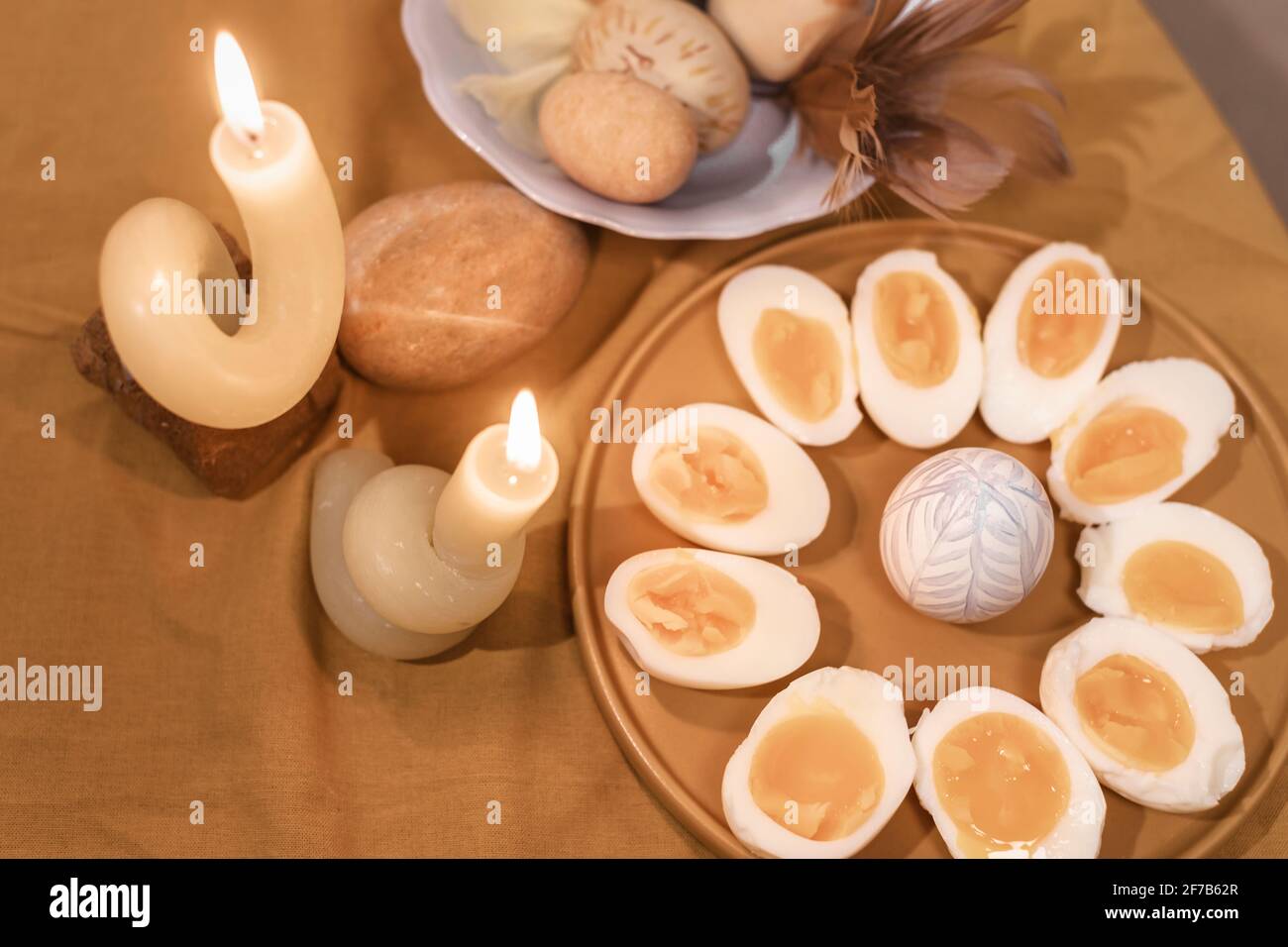 Halved boiled eggs on plate Stock Photo