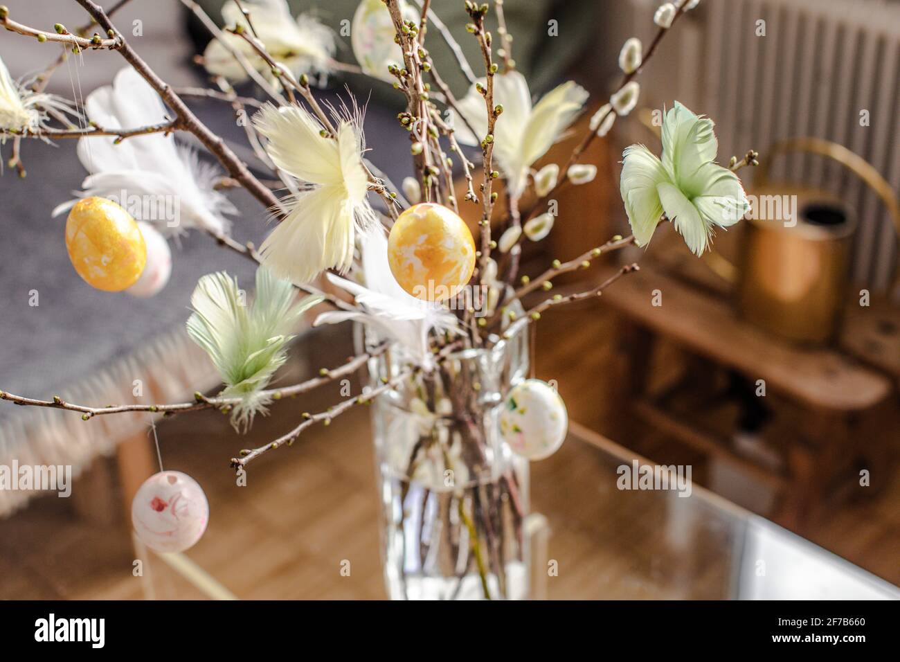 Twigs with hanging Easter eggs Stock Photo