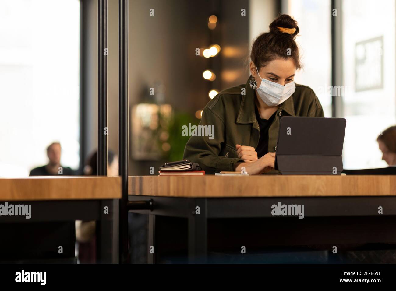 Woman in cafe using digital tablet Stock Photo