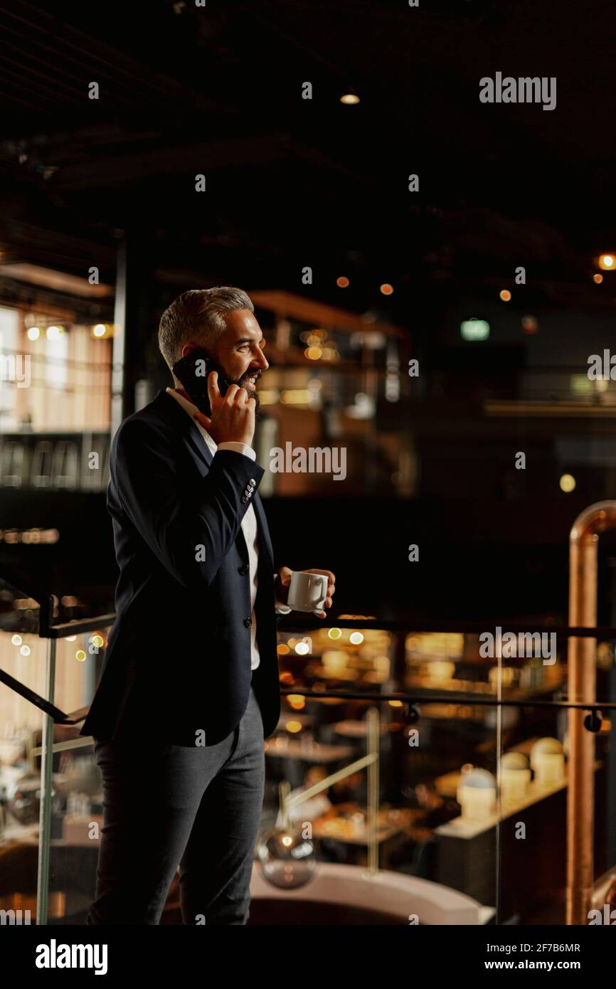 Businessman talking via cell phone Stock Photo
