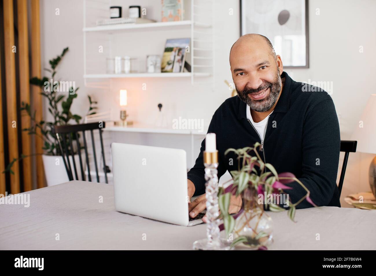 Man using laptop at home Stock Photo