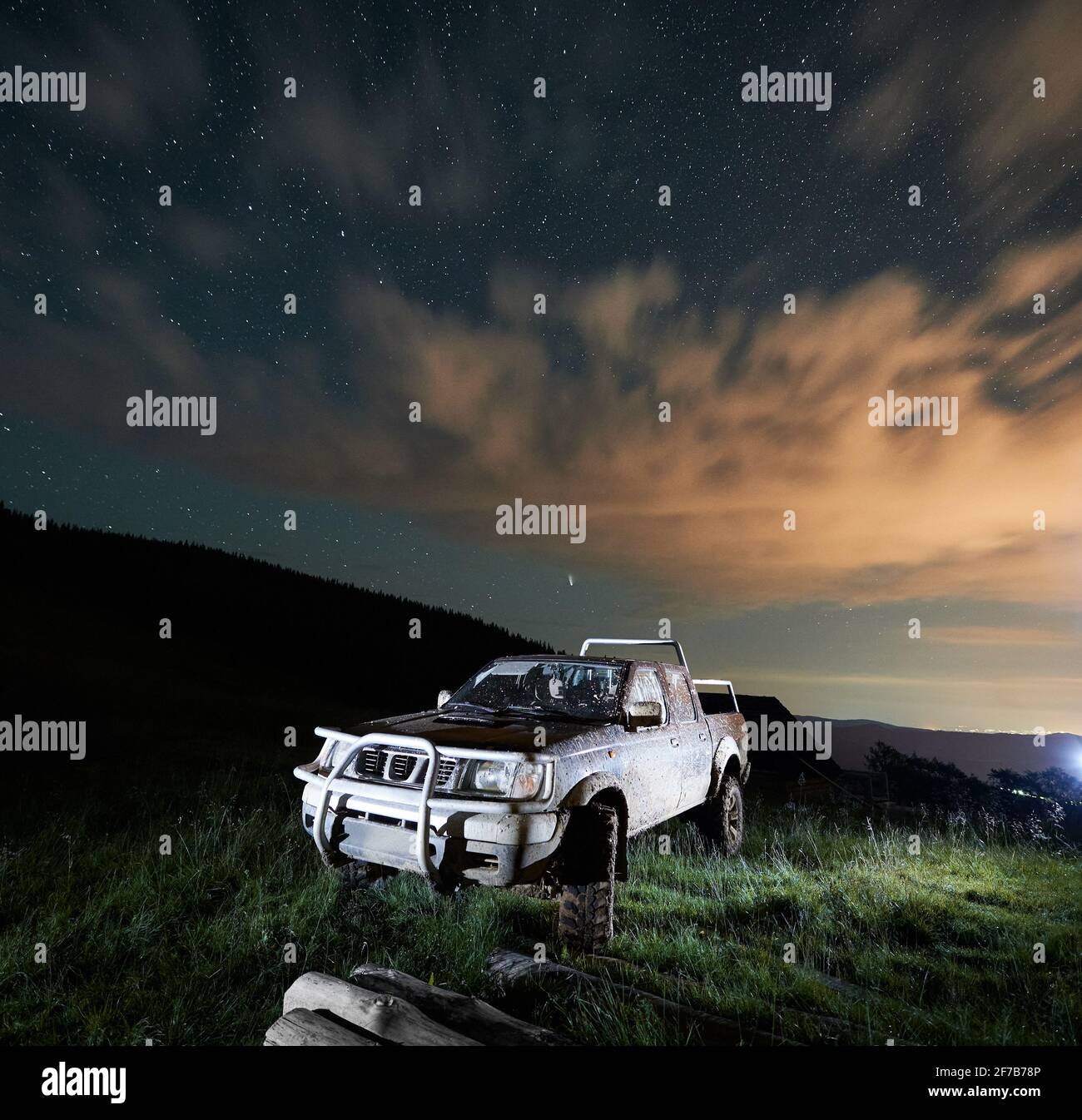 Dirty big car in the mountains at night. Concept of travelling, resting on  nature and looking at starry sky with car Stock Photo - Alamy