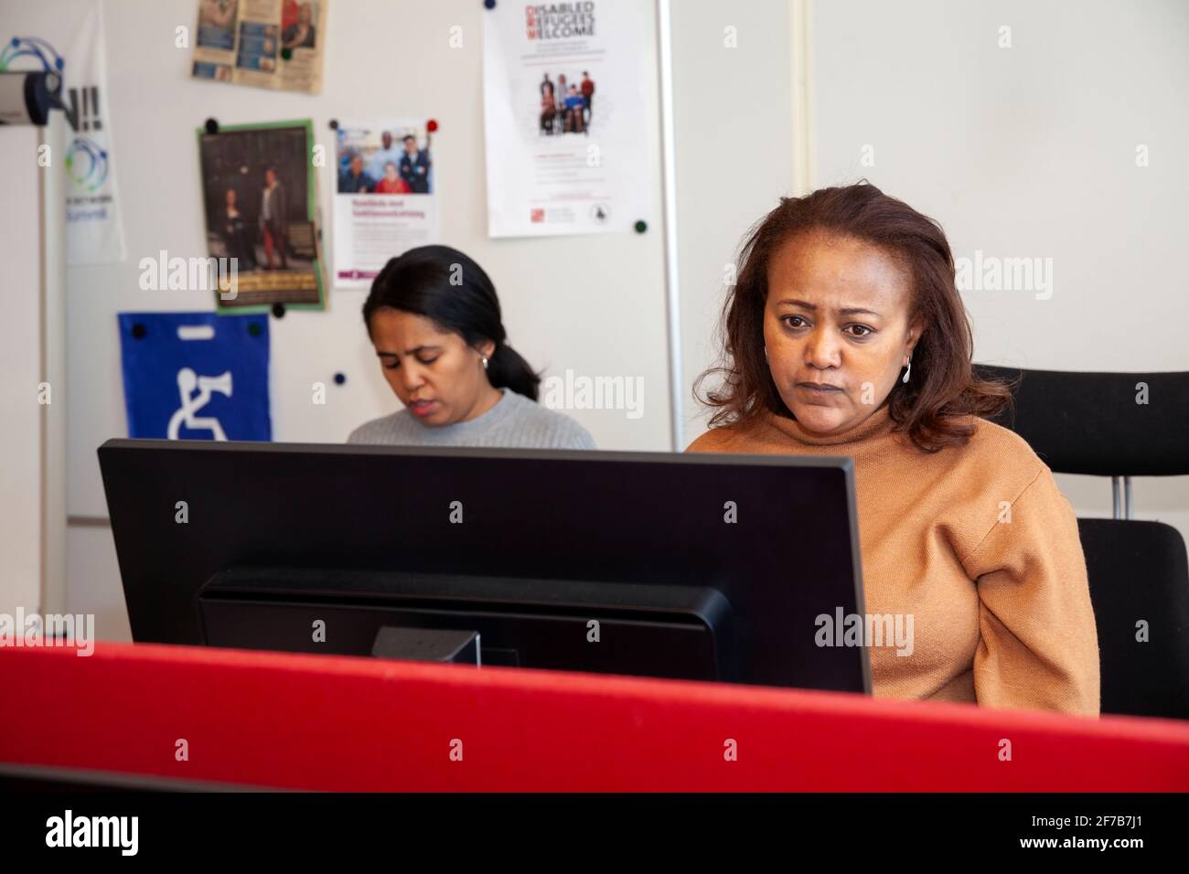 Two women working in office Stock Photo