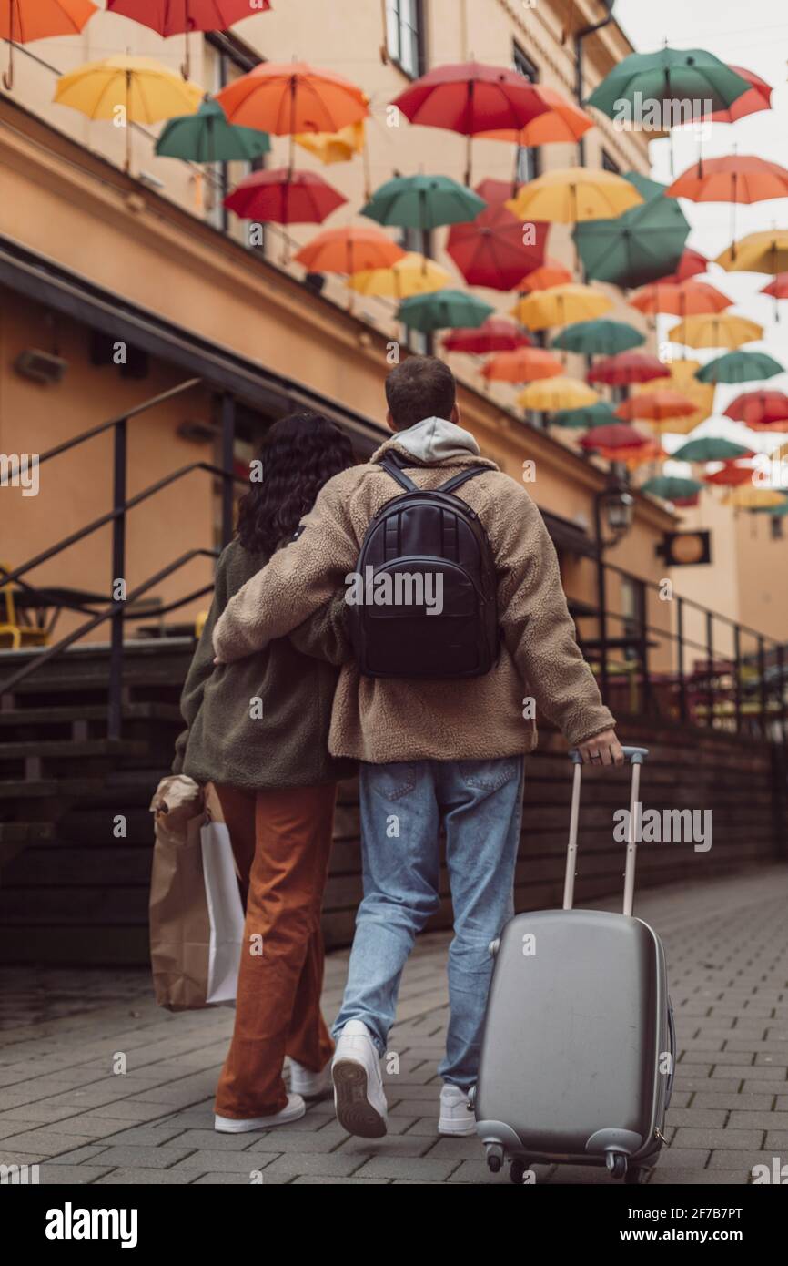 Rear view of couple walking together Stock Photo - Alamy
