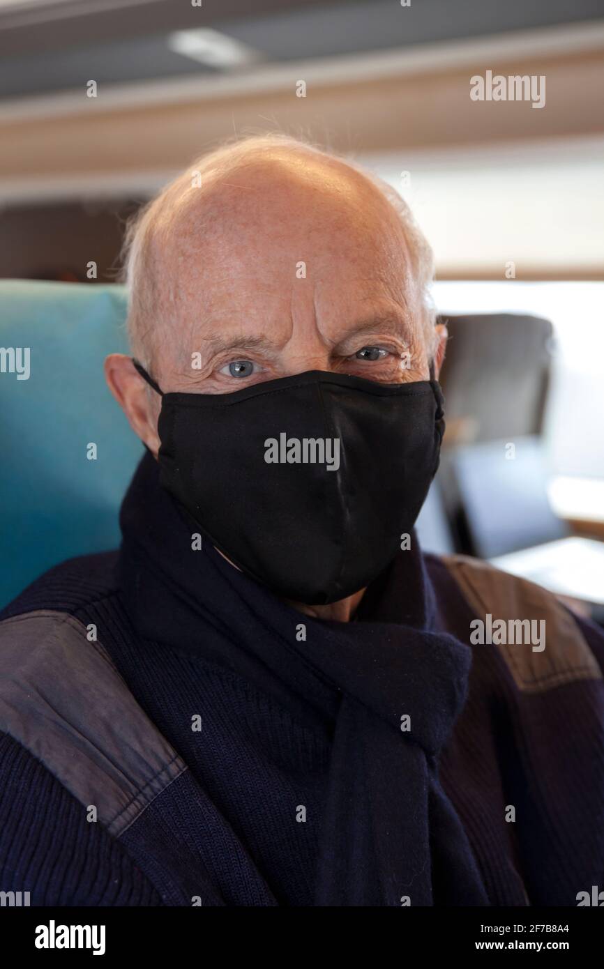 Senior man traveling by train Stock Photo