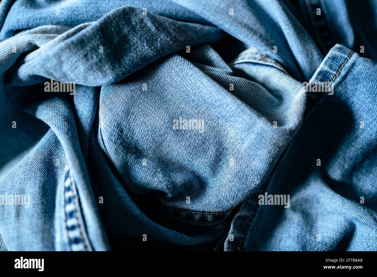 wrinkled blue denim jeans background Stock Photo