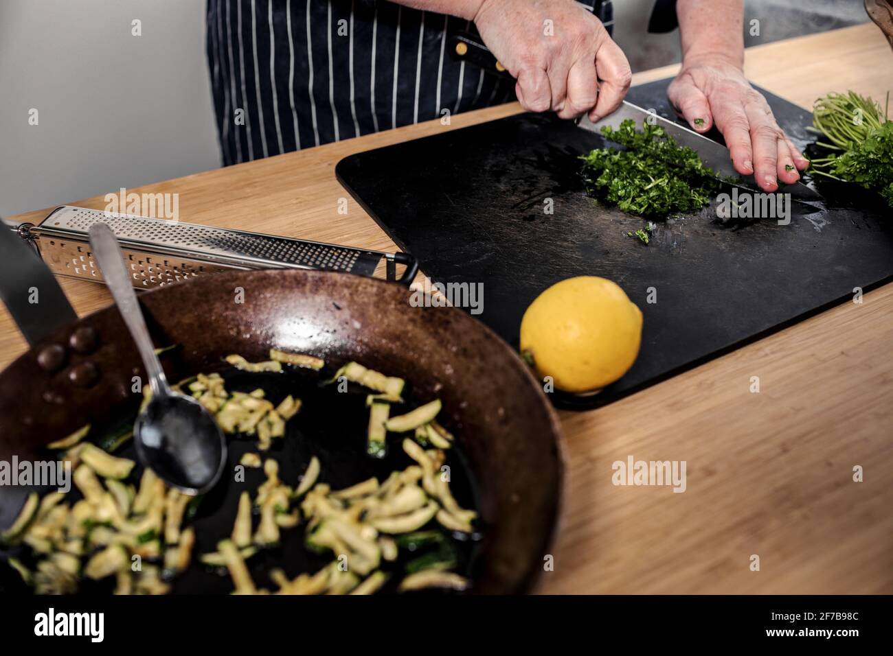 Woman's hands chopping herbs Stock Photo Alamy