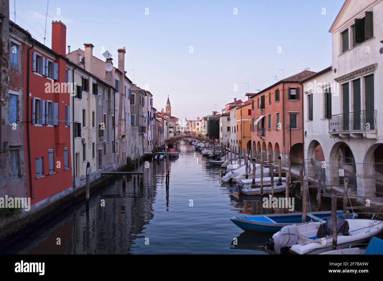 CHIOGGIA, ITALY - SEPTEMBER 15, 2019: The main canal of the city of Chioggia called Little Venice with its boats reflecting the adjacent buildings and Stock Photo