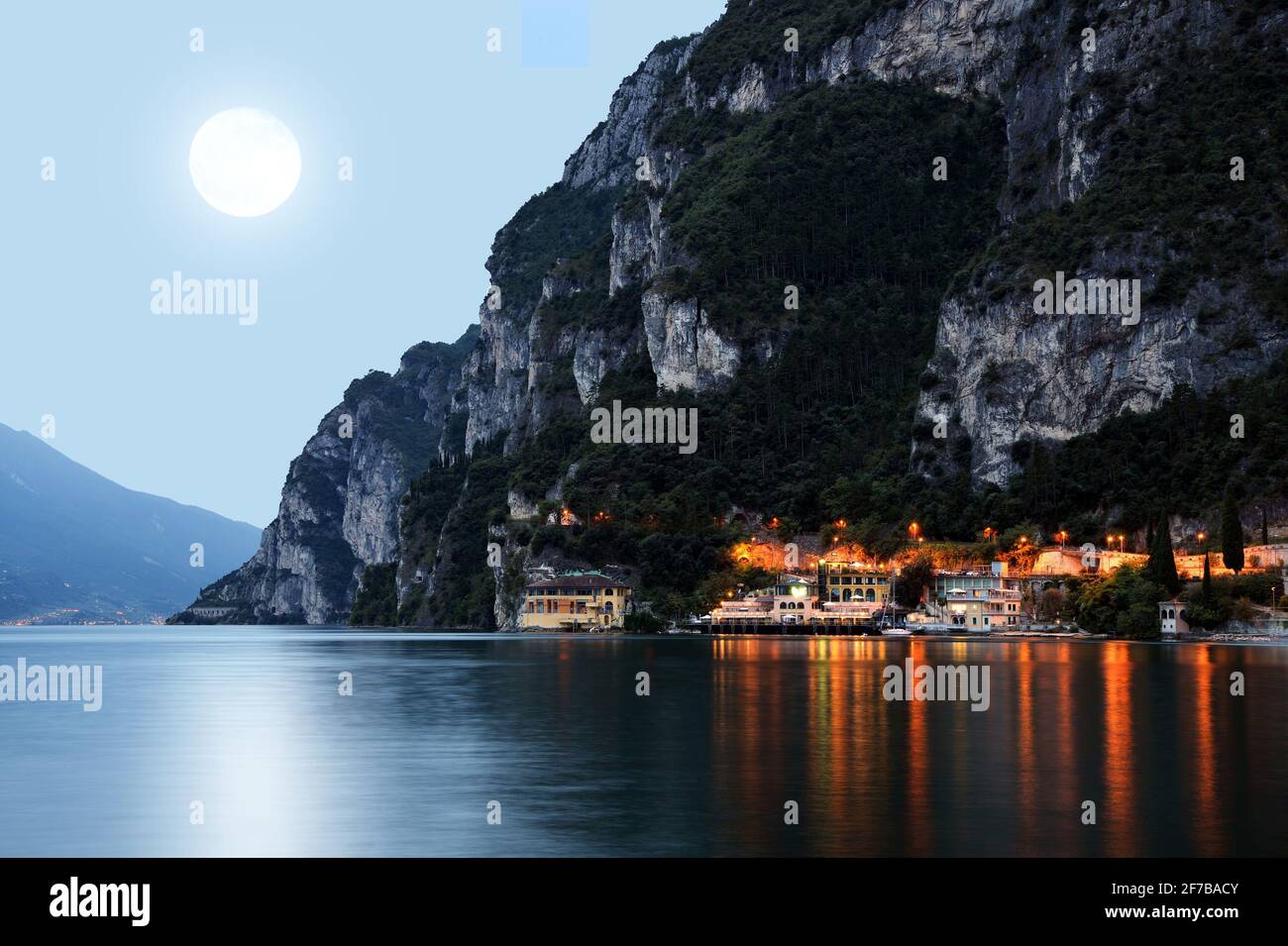 The City Riva Del Garda By Night Garda Lake In Northern Italy Stock the-city-riva-del-garda-by-night-garda-lake-in-northern-italy-stock