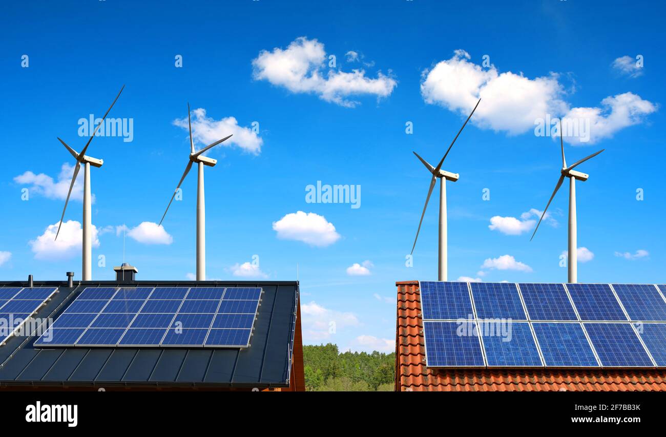 Solar panel on the roof of the house in the background wind turbines ...
