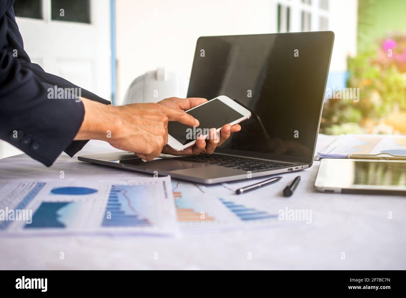 Hand using mobile phone in office work ,Man using smartphone in work ...