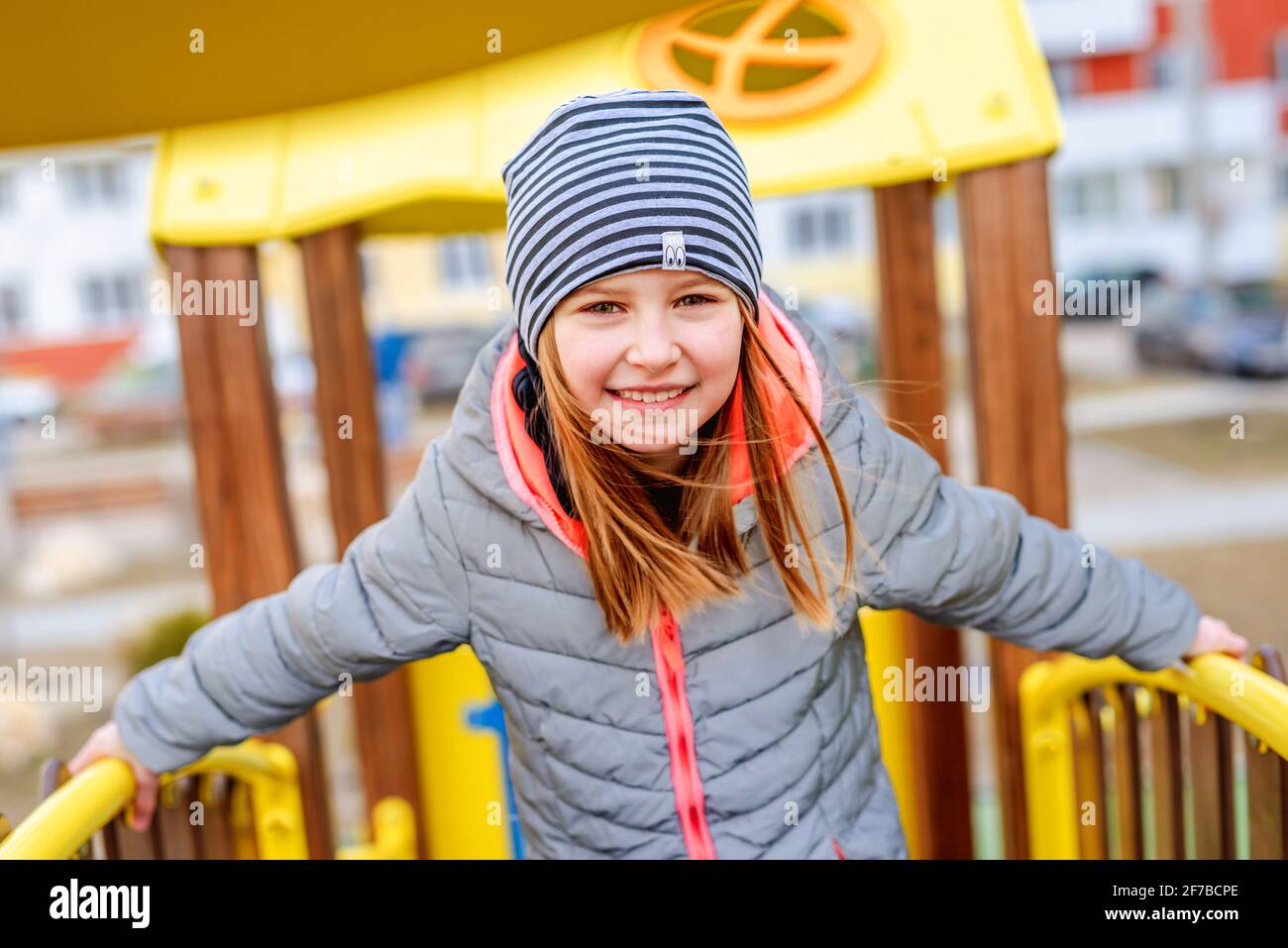Little girl on playground Stock Photo - Alamy