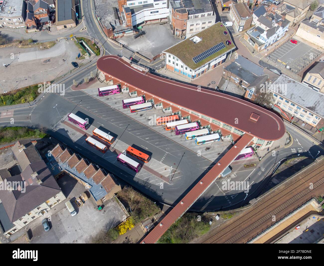 Mansfield Nottingham Bus station aerial view above drone coaches and busses parked modern transport hub boarding passengers commuters and shoppers Stock Photo
