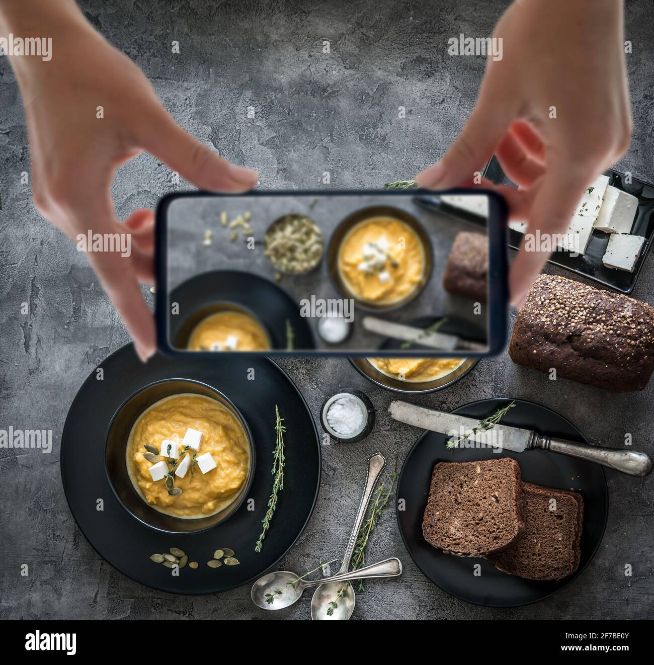 pumpkin soup in black plates Stock Photo