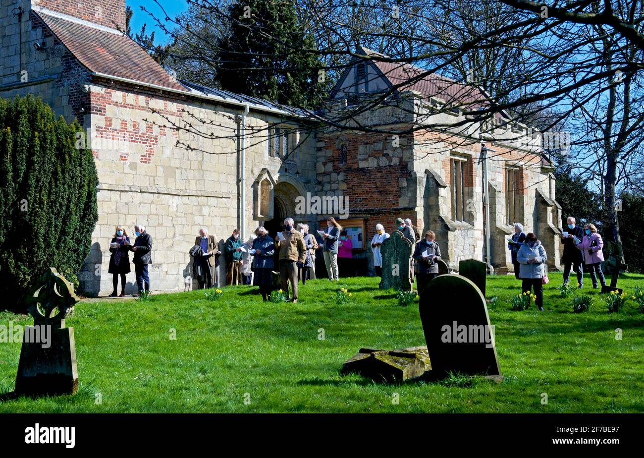 Outdoor, socially distanced service (Easter 2021), St Mary's church in the village of Lockington, East Yorkshire, England UK Stock Photo