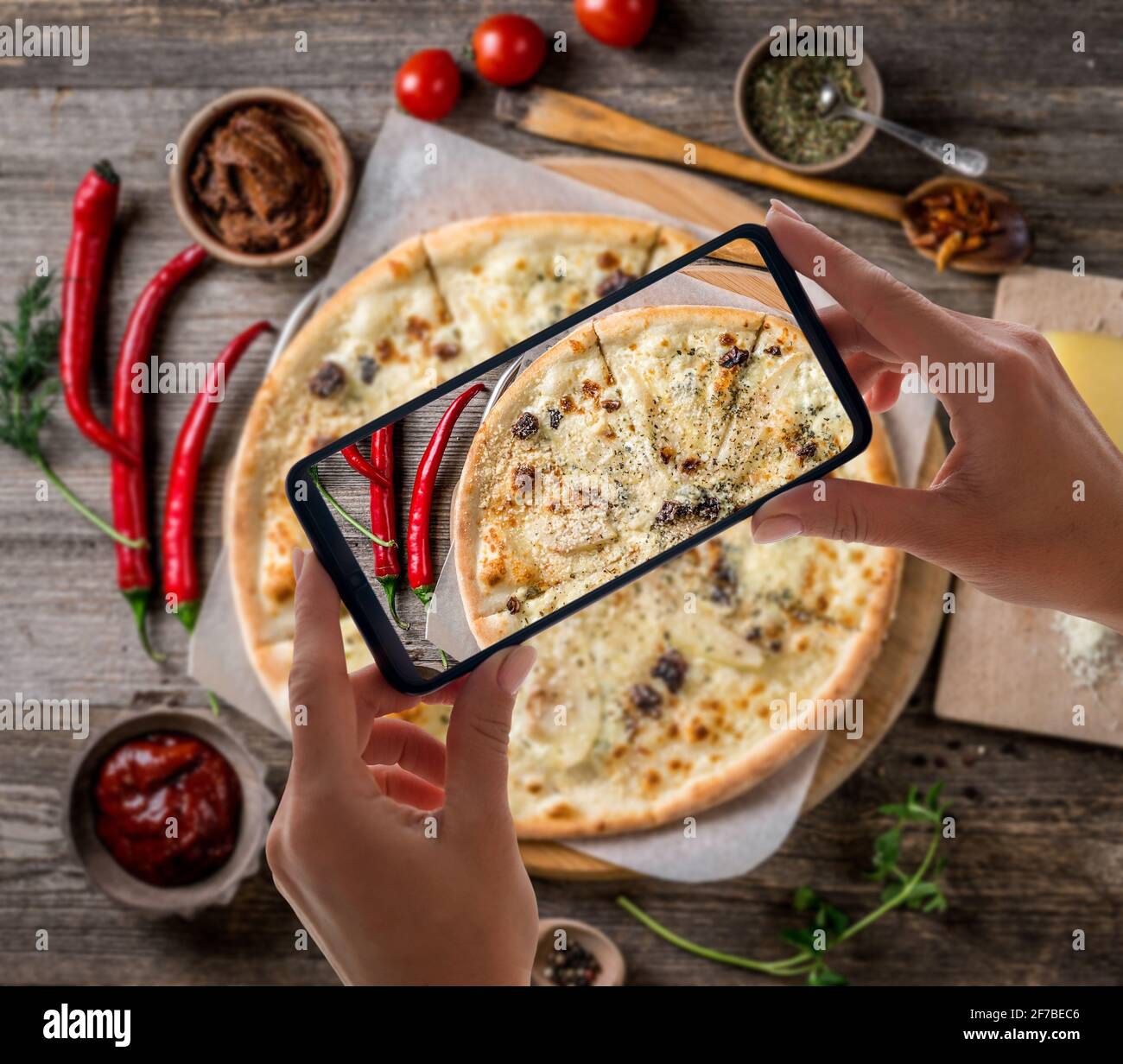 Delicious pizza with nuts and pears, topview Stock Photo