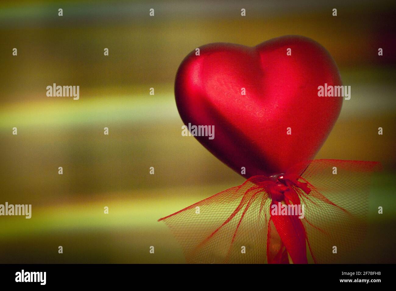 Shiny red heart on rainbow background. Copy space Stock Photo - Alamy