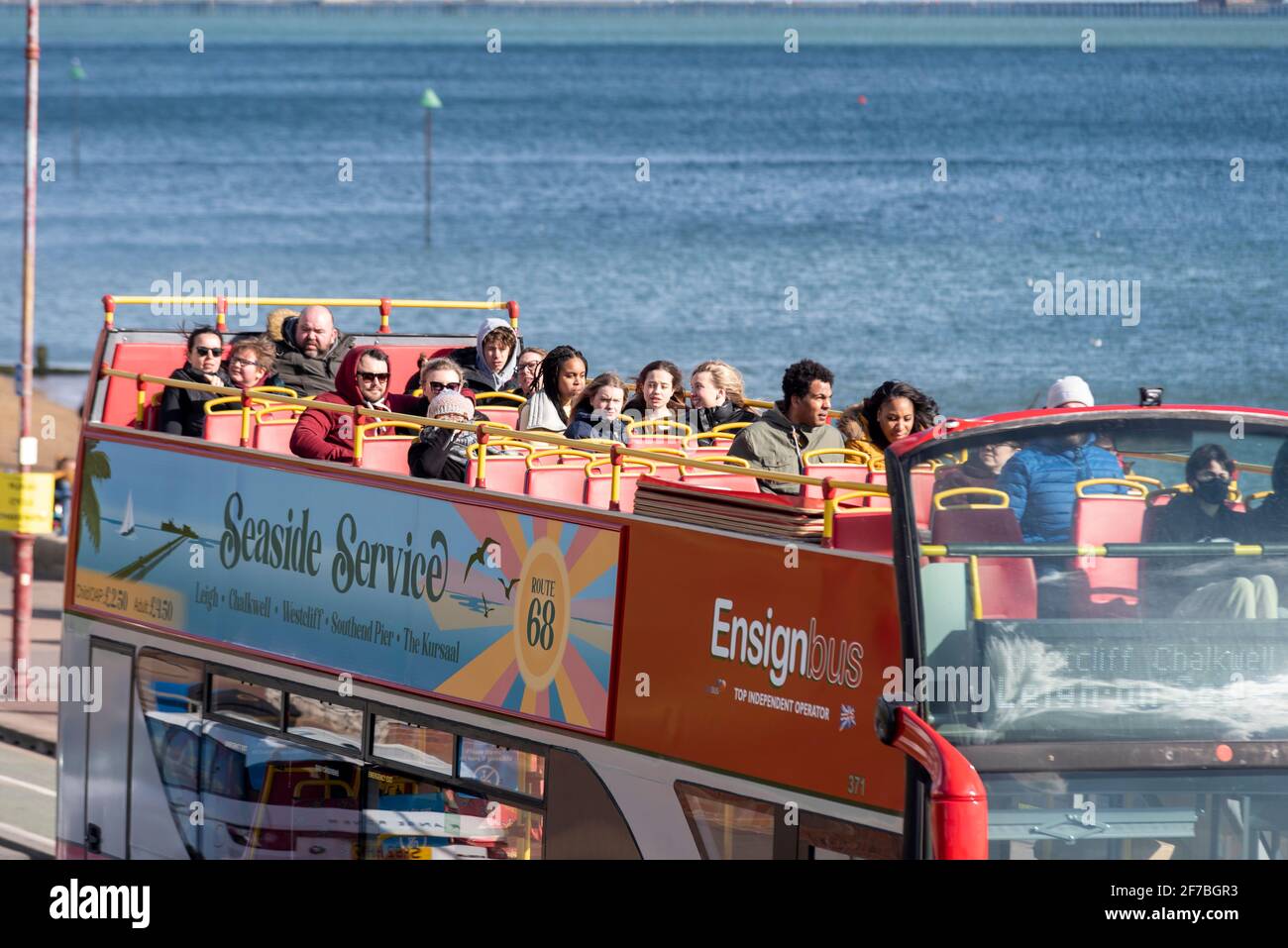 Passengers on the top deck of an Ensignbus open top bus ride in Southend on Sea, Essex, UK, on Easter bank holiday Monday during COVID 19 lockdown Stock Photo