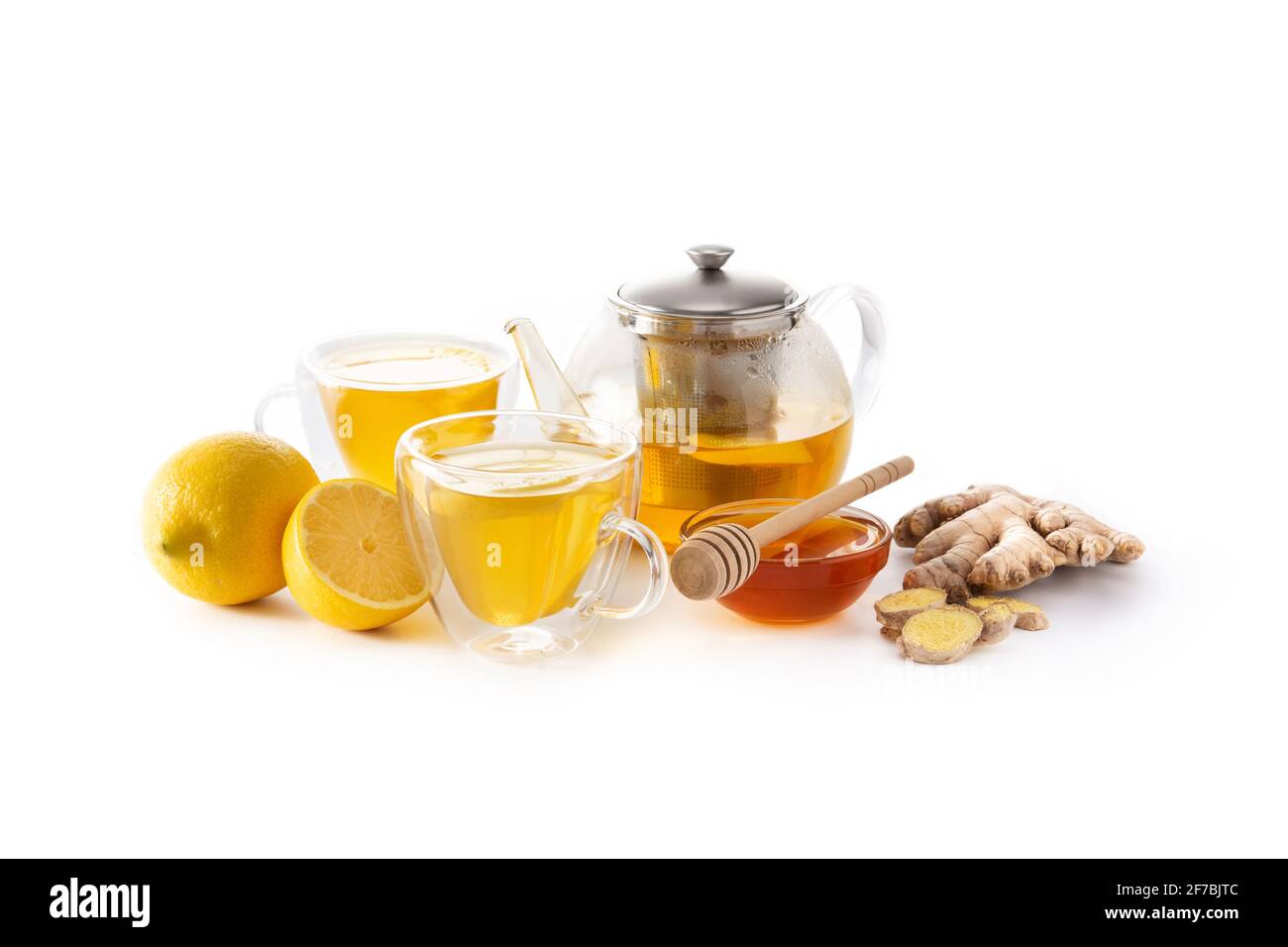 Ginger tea with lemon and honey in crystal glass isolated on white