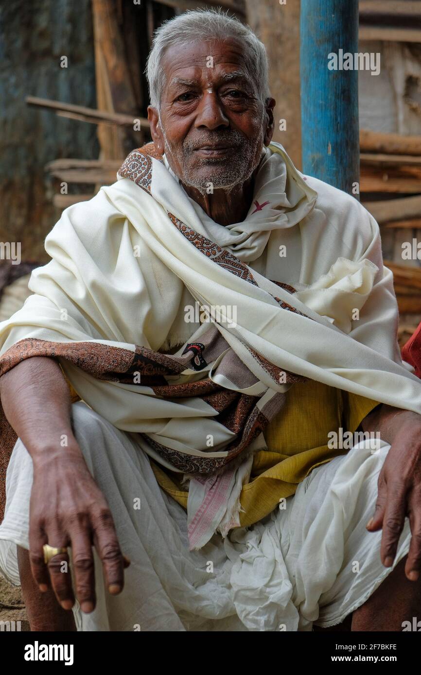 Kunduli, India - February 2021: Portrait of an older man in the Kunduli market on February 19, 2021 in Kunduli, Odisha, India. Stock Photo
