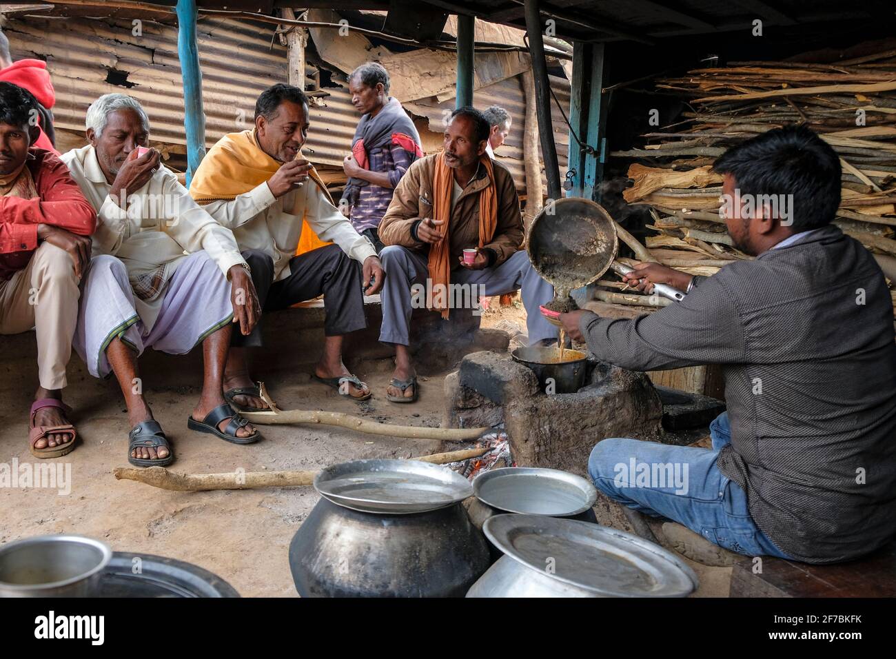 Kunduli, India - February 2021: A group of men drinking tea in the Kunduli market on February 19, 2021 in Kunduli, Odisha, India. Stock Photo