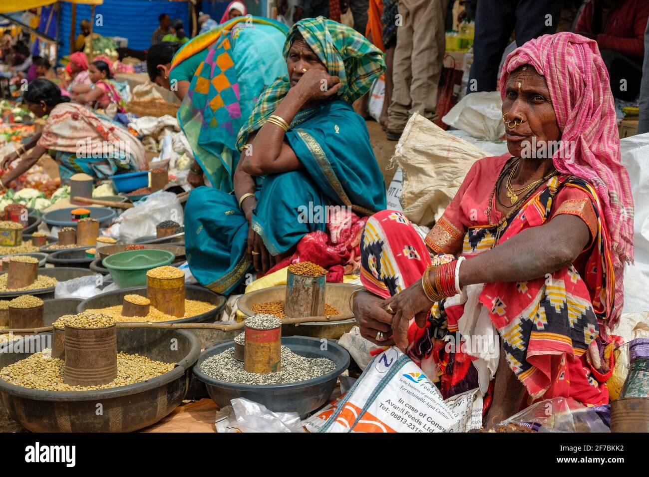 Kunduli, India - February 2021: Adivasi women from the Desia Kondh tribe selling vegetables in the Kunduli market on February 19, 2021 in, Odisha. Stock Photo