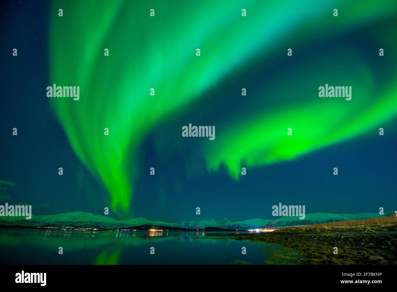 polar light over Kvaloeya, Norway, Troms, Tromsoe Stock Photo