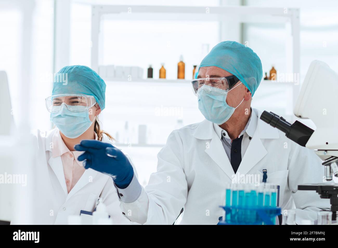 group of scientists discussing online data in the laboratory Stock ...