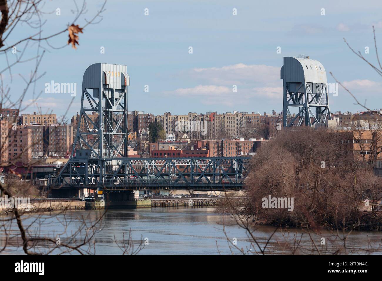 view of the Broadway Bridge, a double deck vertical lift bridge, connecting Inwood in Northern Manhattan to Marble HIll and the Bronx from across the Stock Photo