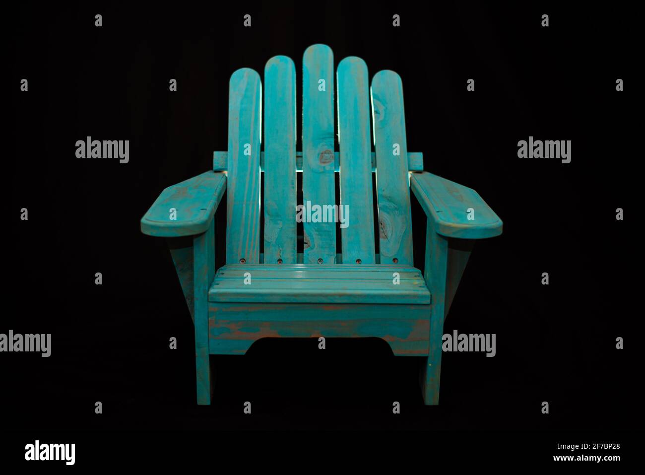 Teal Chair against black background Stock Photo