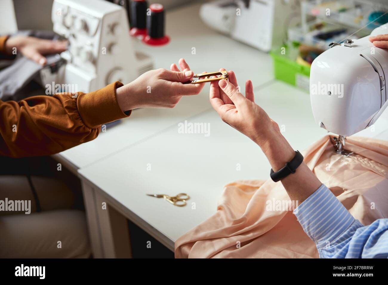 Female receiving thread cutter during sewing process Stock Photo Alamy