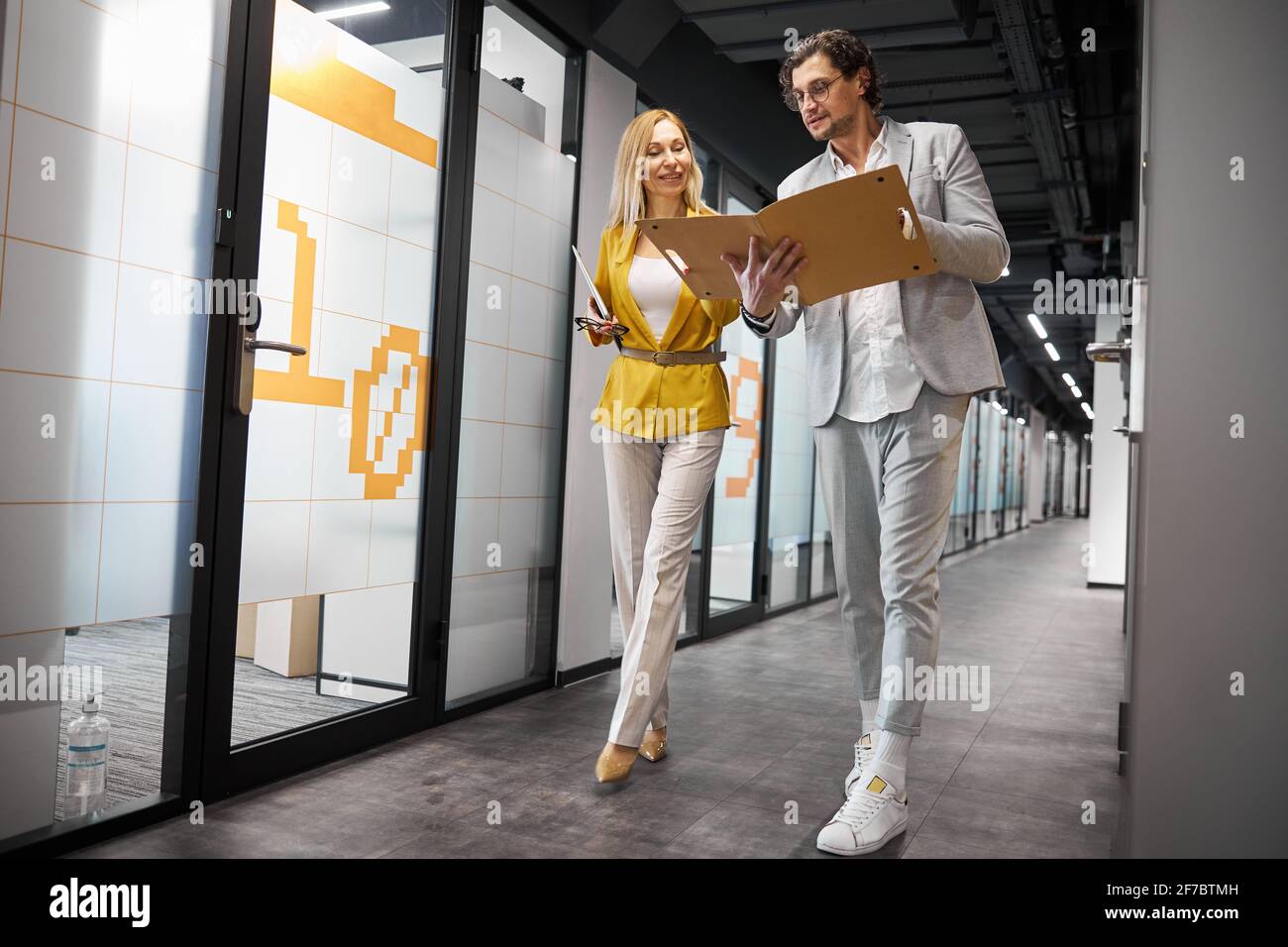 Attentive bearded man checking folder with documents Stock Photo