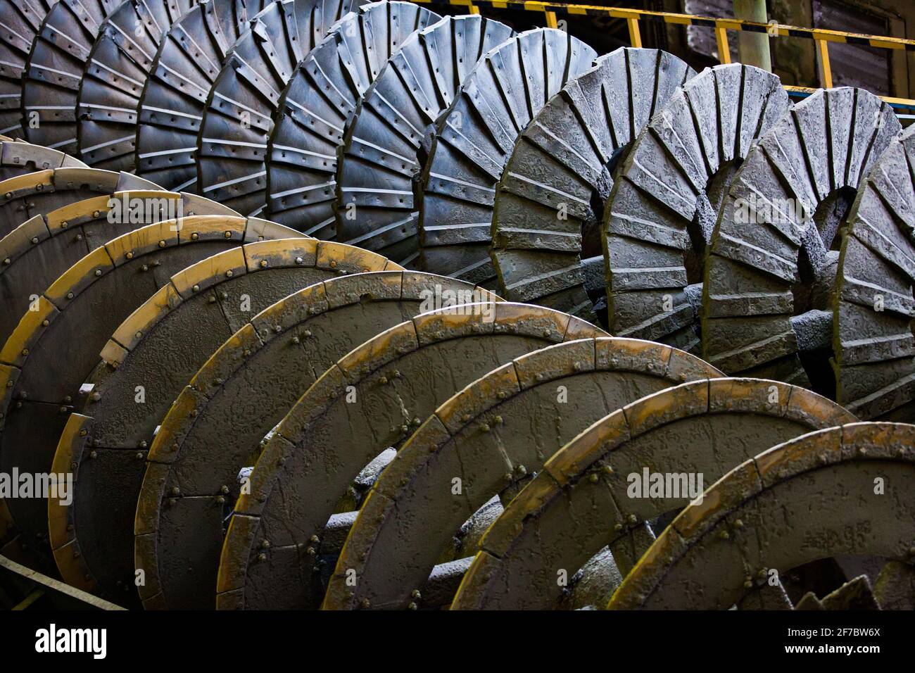 Screw conveyor close-up. Ore concentration plant. Focus on upper spiral only. Stock Photo