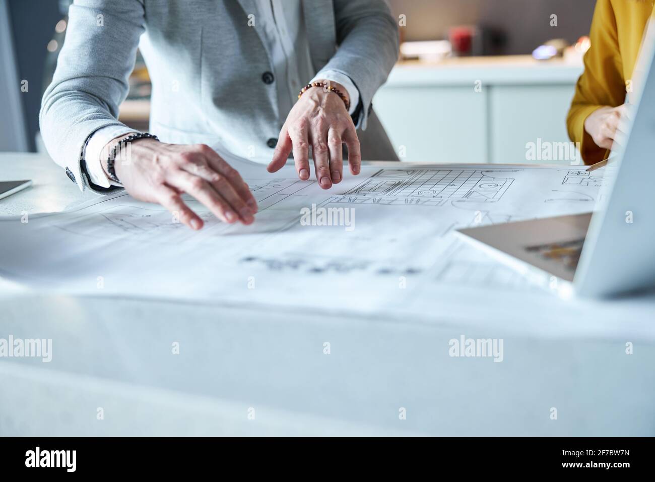 Competent architect demonstrating idea to his colleague Stock Photo - Alamy