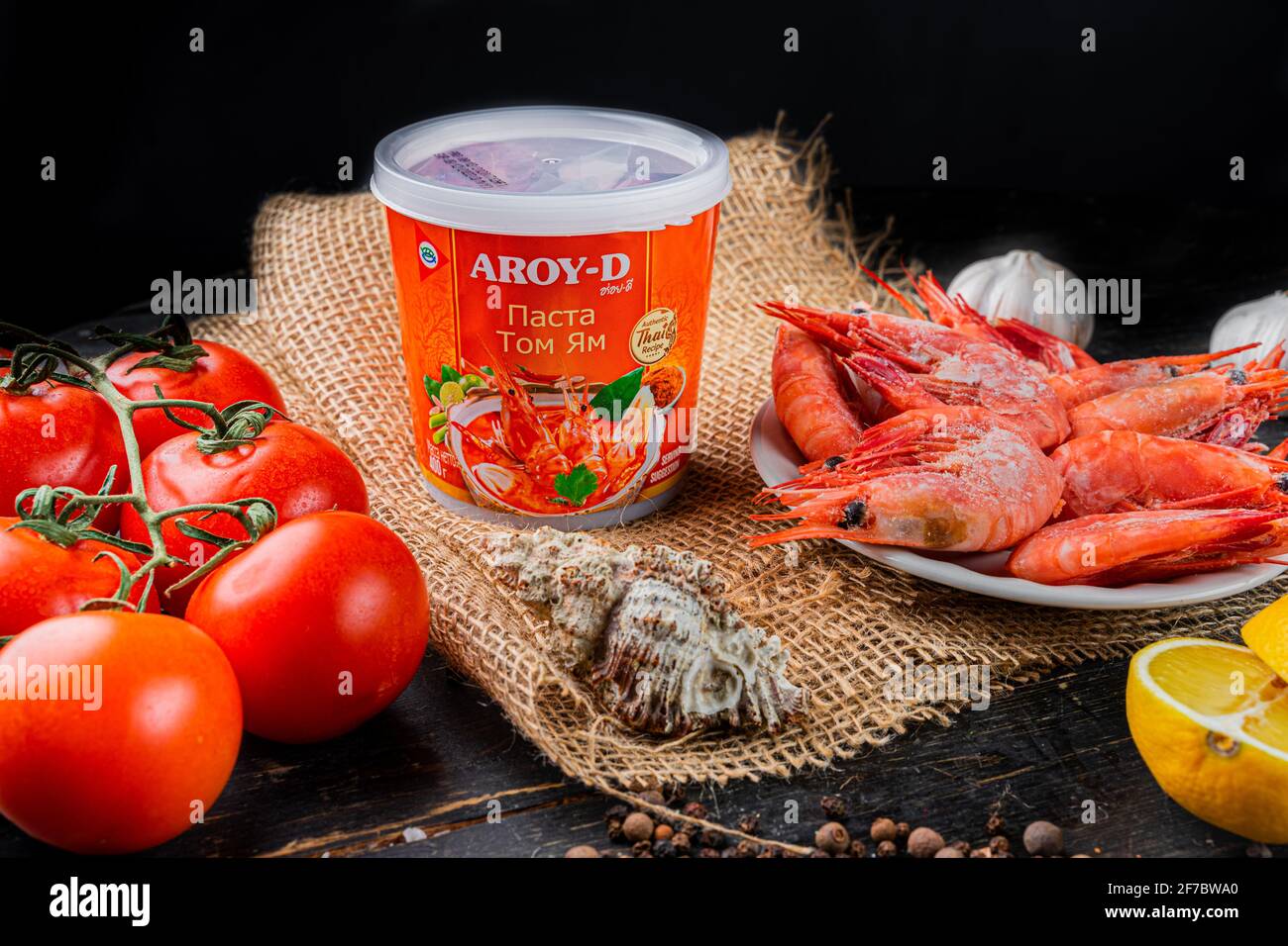 Plastic jar of Tom Yam Paste brand name AROY-D. Tom Yam paste is made by crushing all the herb ingredients and stir frying in oil Stock Photo
