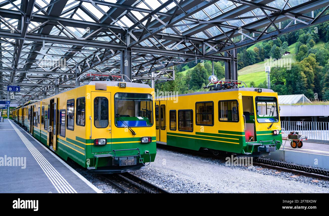 Passenger trains at Lauterbrunnen railway station in Switzerland Stock Photo