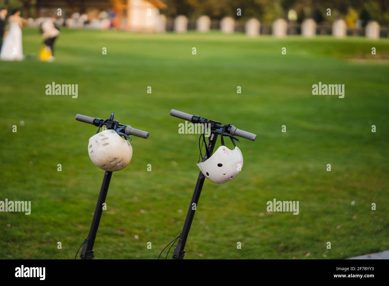 two electric kick scooters or e-scooter parked on the sidelines road Stock  Photo - Alamy