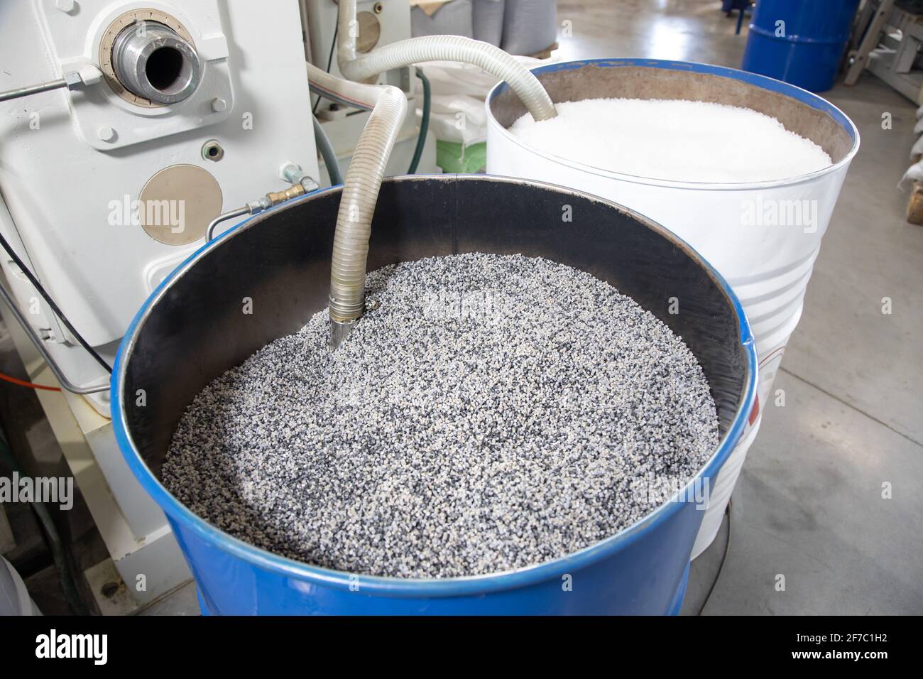 Open barrel full grain malt. White polypropylene bag. PP Stock Photo