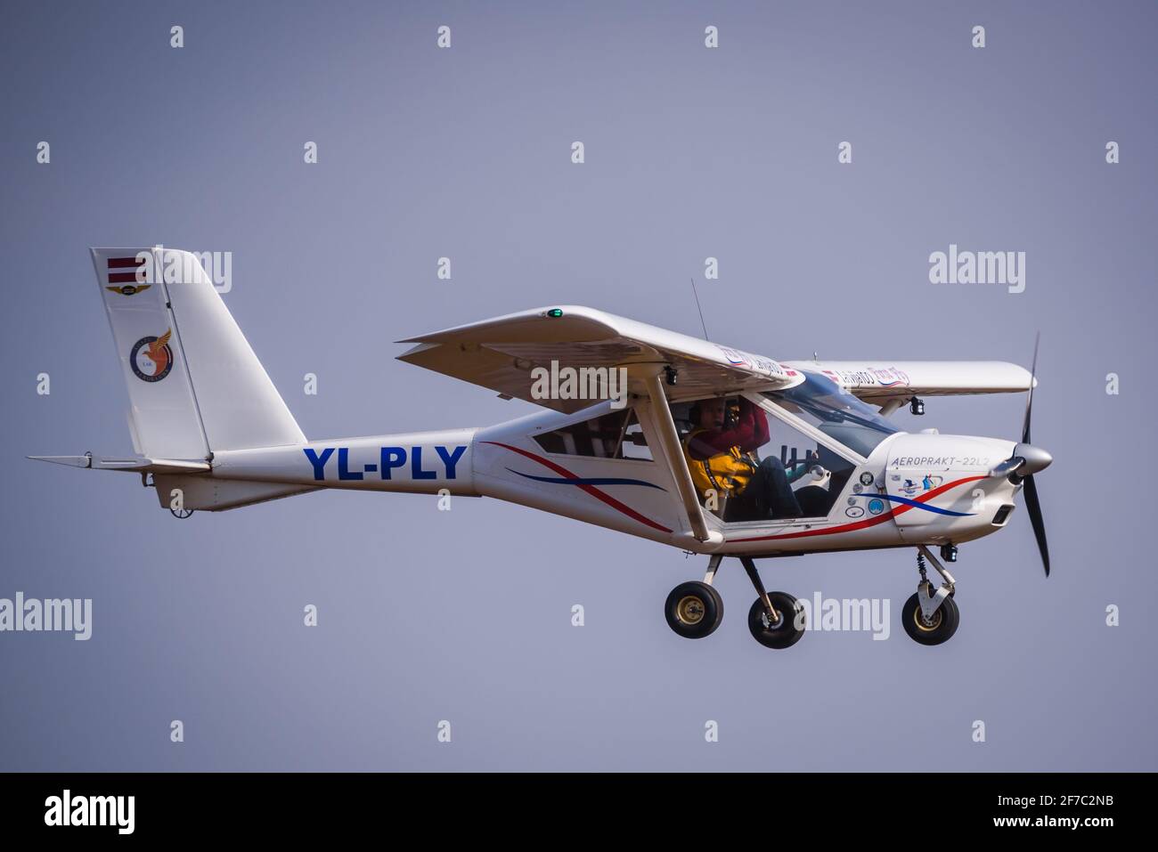 A DAZI, LATVIA. 27th March 2021. Aeropakt A22 L2 Foxbat YL PLY airplane flying in the sky. Stock Photo