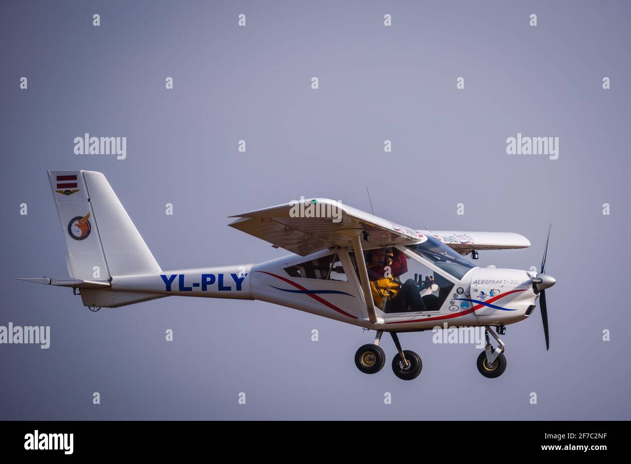 A DAZI, LATVIA. 27th March 2021. Aeropakt A22 L2 Foxbat YL PLY airplane flying in the sky. Stock Photo