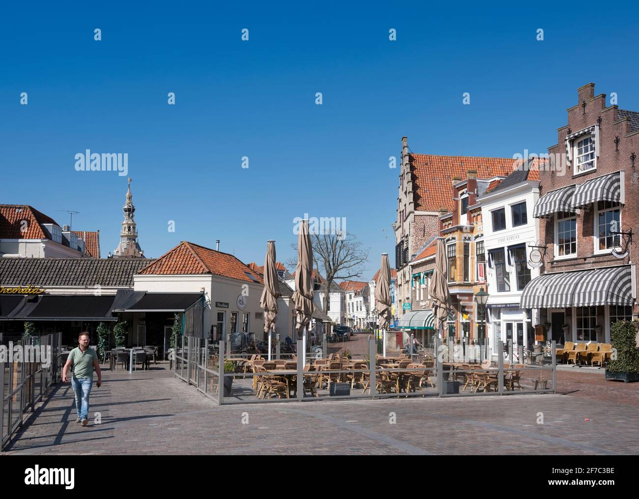 man on old square in dutch town of zierikzee in spring Stock Photo