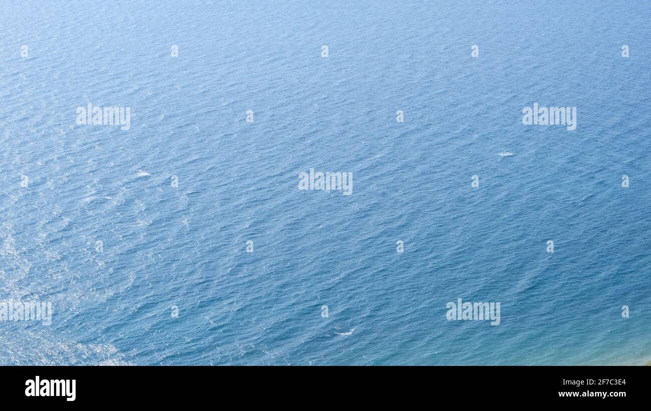 Ripples on the surface of blue sea water Stock Photo - Alamy