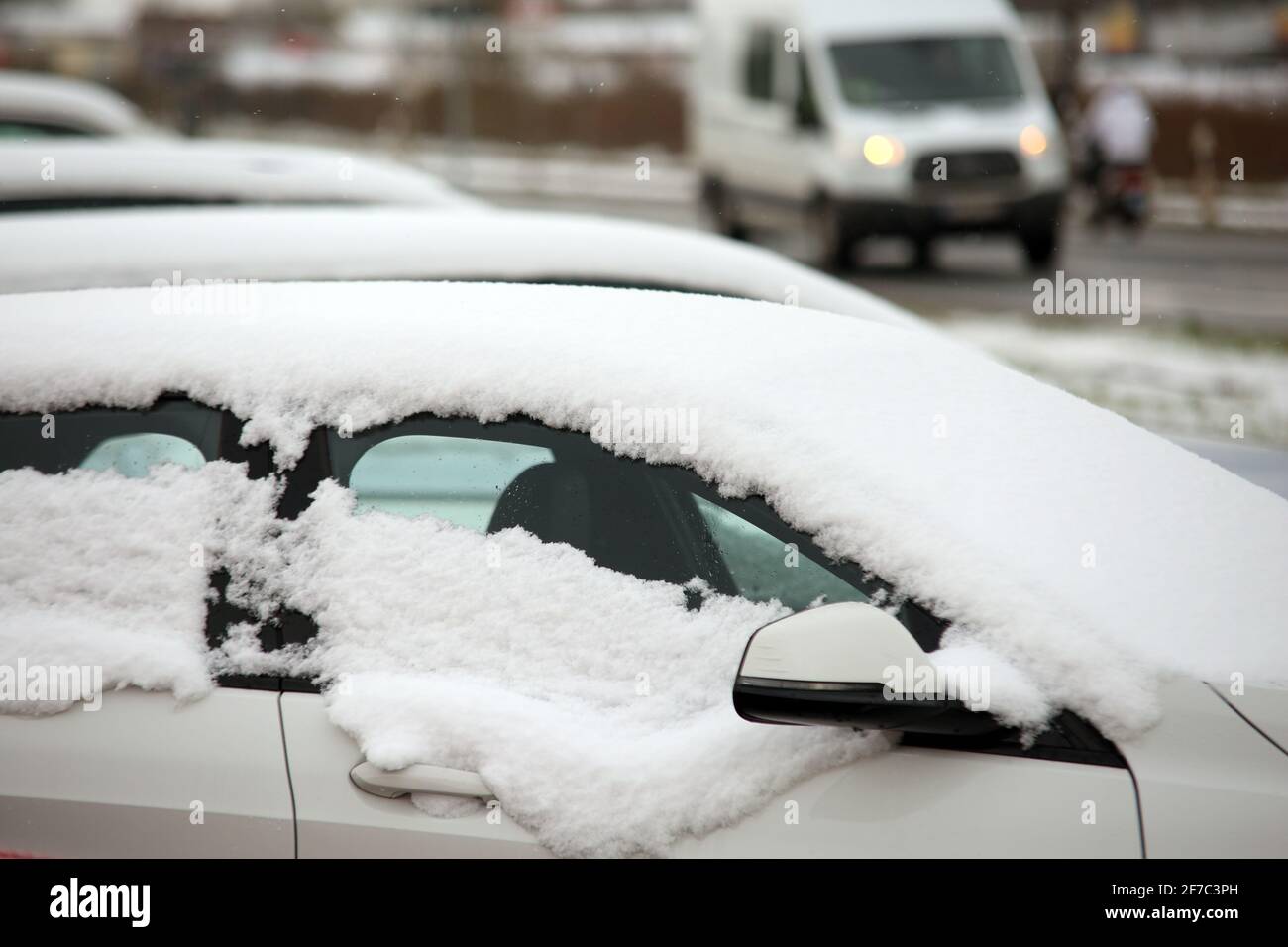 Nordhausen, Germany. 06th Apr, 2021. A vehicle is covered in snow on a